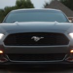 Mustang Auto - black Ford Mustang on gray pavement