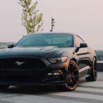 Ford Mustang - black Ford Mustang coupe parked near green tree