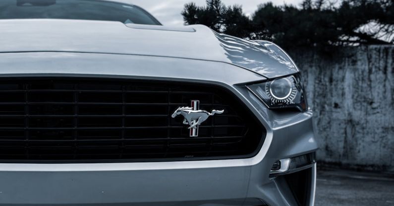 Mustang Auto - Close Up Photo of a Silver Ford Mustang